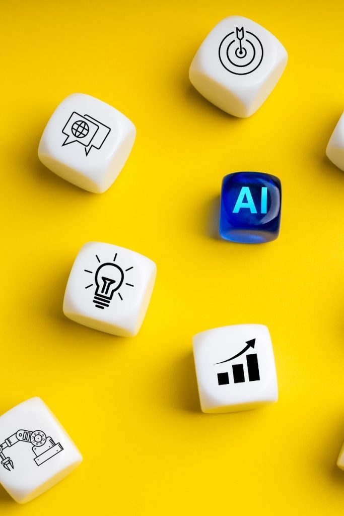Several dice with AI and search imagery on a yellow surface