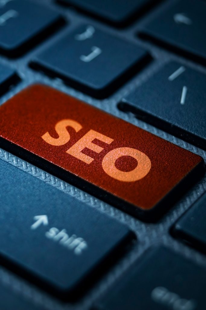 A keyboard featuring one orange SEO button